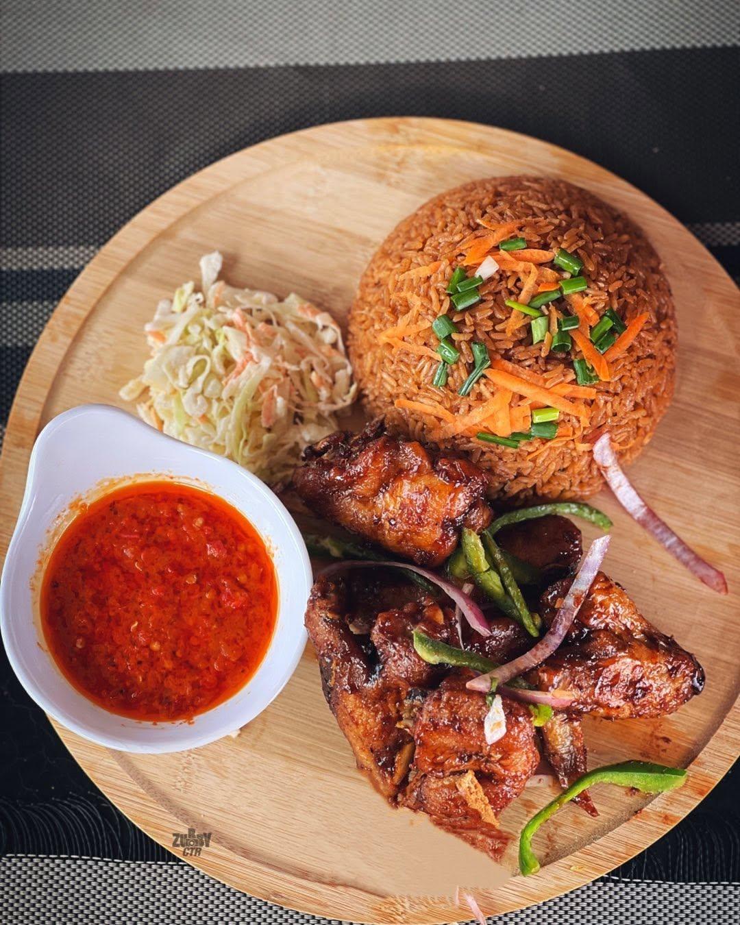 Jollof and chicken serving